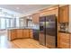 Modern kitchen with stainless steel appliances and wood cabinets at 5170 Stone Croft Trl, Atlanta, GA 30331
