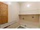 Laundry room with built-in shelving and ironing board at 5170 Stone Croft Trl, Atlanta, GA 30331