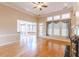 Living room features hardwood floors, fireplace, and access to sunroom at 5170 Stone Croft Trl, Atlanta, GA 30331