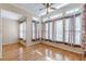 Sunroom with hardwood floors, multiple windows, and ceiling fan at 5170 Stone Croft Trl, Atlanta, GA 30331