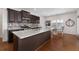 Modern kitchen featuring granite island and dark cabinetry at 2325 Button Head Nw Run, Kennesaw, GA 30144