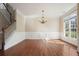 Bright dining room with hardwood floors and wainscoting at 3606 High Battery Nw Blf, Acworth, GA 30101