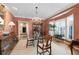 Elegant dining room with coral walls, chandelier, and large windows at 28 Ridgemere Trce, Atlanta, GA 30328