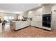 Large kitchen with white cabinets, herringbone tile floor and island at 28 Ridgemere Trce, Atlanta, GA 30328