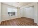 Bright dining room with hardwood floors and chandelier at 1331 Pine Acre Dr, Sugar Hill, GA 30518