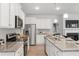 Modern kitchen with stainless steel appliances and granite countertops at 693 Cygnet Ln, Grayson, GA 30017