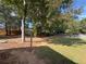 Large backyard with mature trees and a shed at 200 Suffolk Way, Mcdonough, GA 30252