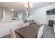 Open dining area with a dark wood table and seating for six at 3112 Spicy Cedar Ln, Lithonia, GA 30038