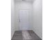 Bright foyer with gray vinyl flooring and neutral walls at 3112 Spicy Cedar Ln, Lithonia, GA 30038