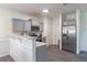 Updated kitchen featuring gray cabinets and stainless steel appliances at 3112 Spicy Cedar Ln, Lithonia, GA 30038