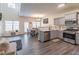 Modern kitchen with gray cabinets, stainless steel appliances, and a breakfast bar at 3112 Spicy Cedar Ln, Lithonia, GA 30038