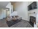 Open living area with a fireplace, gray flooring, and neutral decor at 3112 Spicy Cedar Ln, Lithonia, GA 30038
