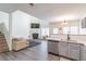 Spacious living room with fireplace and kitchen view at 3112 Spicy Cedar Ln, Lithonia, GA 30038