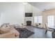 Spacious living room featuring a cozy fireplace and high ceilings at 3112 Spicy Cedar Ln, Lithonia, GA 30038