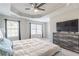 Main bedroom with ceiling fan, dresser and large bed at 3112 Spicy Cedar Ln, Lithonia, GA 30038