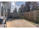 Private patio with a wooden fence and grill at 3112 Spicy Cedar Ln, Lithonia, GA 30038