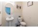 Clean powder room with pedestal sink and toilet at 3112 Spicy Cedar Ln, Lithonia, GA 30038