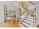 Two-story entryway with hardwood floors and elegant staircase at 4270 Ridgehurst Se Dr, Smyrna, GA 30080