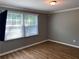 Bright bedroom with two windows and wood-look floors at 723 Casplan Sw St, Atlanta, GA 30310