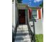 Front entrance with brick steps and a decorative metal railing at 723 Casplan Sw St, Atlanta, GA 30310