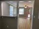 Open living room with wood-look floors and view into kitchen at 723 Casplan Sw St, Atlanta, GA 30310