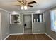 Living room with hardwood floors and a view into the kitchen at 723 Casplan Sw St, Atlanta, GA 30310