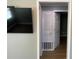 Living room with mounted TV and access to bedroom and closet at 723 Casplan Sw St, Atlanta, GA 30310