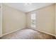 Bright bedroom with carpeted floor and window at 312 Magnolia Springs Trce, Canton, GA 30115