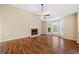 Living room with hardwood floors, fireplace, and large windows at 312 Magnolia Springs Trce, Canton, GA 30115