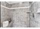 Large walk-in shower with grey tile and built-in shelving at 2182 Nillville Dr, Buford, GA 30519