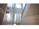 Two-story entryway with wainscoting and hardwood floors at 337 Creek Manor Way, Suwanee, GA 30024