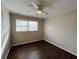 Bright bedroom with ceiling fan and wood-look flooring at 422 Windsor Dr, Forest Park, GA 30297