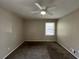 Spacious bedroom with ceiling fan and neutral wall colors at 422 Windsor Dr, Forest Park, GA 30297