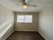 Bright bedroom with wood-look floors and a ceiling fan at 422 Windsor Dr, Forest Park, GA 30297