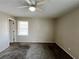 Spacious bedroom with ceiling fan and neutral wall colors at 422 Windsor Dr, Forest Park, GA 30297