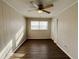 Bright bedroom with ceiling fan and wood-look flooring at 422 Windsor Dr, Forest Park, GA 30297