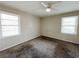 Spacious bedroom with ceiling fan and neutral wall colors at 422 Windsor Dr, Forest Park, GA 30297