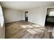 Bright living room with hardwood floors and neutral walls at 422 Windsor Dr, Forest Park, GA 30297