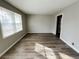 Bright living room with hardwood floors and neutral walls at 422 Windsor Dr, Forest Park, GA 30297