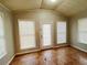 Bright sunroom with tile flooring, multiple windows, and exterior access at 422 Windsor Dr, Forest Park, GA 30297