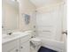 Clean bathroom with a shower/tub combo, vanity, and toilet at 4133 Royal Regency Nw Cir, Kennesaw, GA 30144