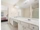 Bathroom with a double vanity and a view into bedroom at 4133 Royal Regency Nw Cir, Kennesaw, GA 30144