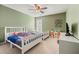 Bright bedroom with two twin beds, ceiling fan, and ample storage at 4133 Royal Regency Nw Cir, Kennesaw, GA 30144