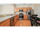 Modern kitchen featuring stainless steel appliances and wood cabinets at 4133 Royal Regency Nw Cir, Kennesaw, GA 30144