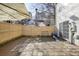 Checkered-pattern patio with wooden fence and gate at 4133 Royal Regency Nw Cir, Kennesaw, GA 30144