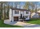 Two-story house with white siding, dark trim, and a grassy yard at 4627 Hairston Crossing Pl, Stone Mountain, GA 30083