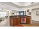 Open kitchen island with stainless steel appliances and wood cabinets at 234 Ashford Cir, Atlanta, GA 30338