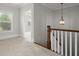 Upstairs hallway with carpet, neutral walls, and a view of a bedroom at 3348 Old Concord Se Rd, Smyrna, GA 30082