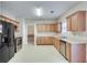 Spacious kitchen with ample wood cabinets and stainless steel appliances at 3402 Newtons Crest Cir, Snellville, GA 30078