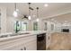 Open concept kitchen with island and view into adjacent living room at 2911 Bentwood Dr, Marietta, GA 30062